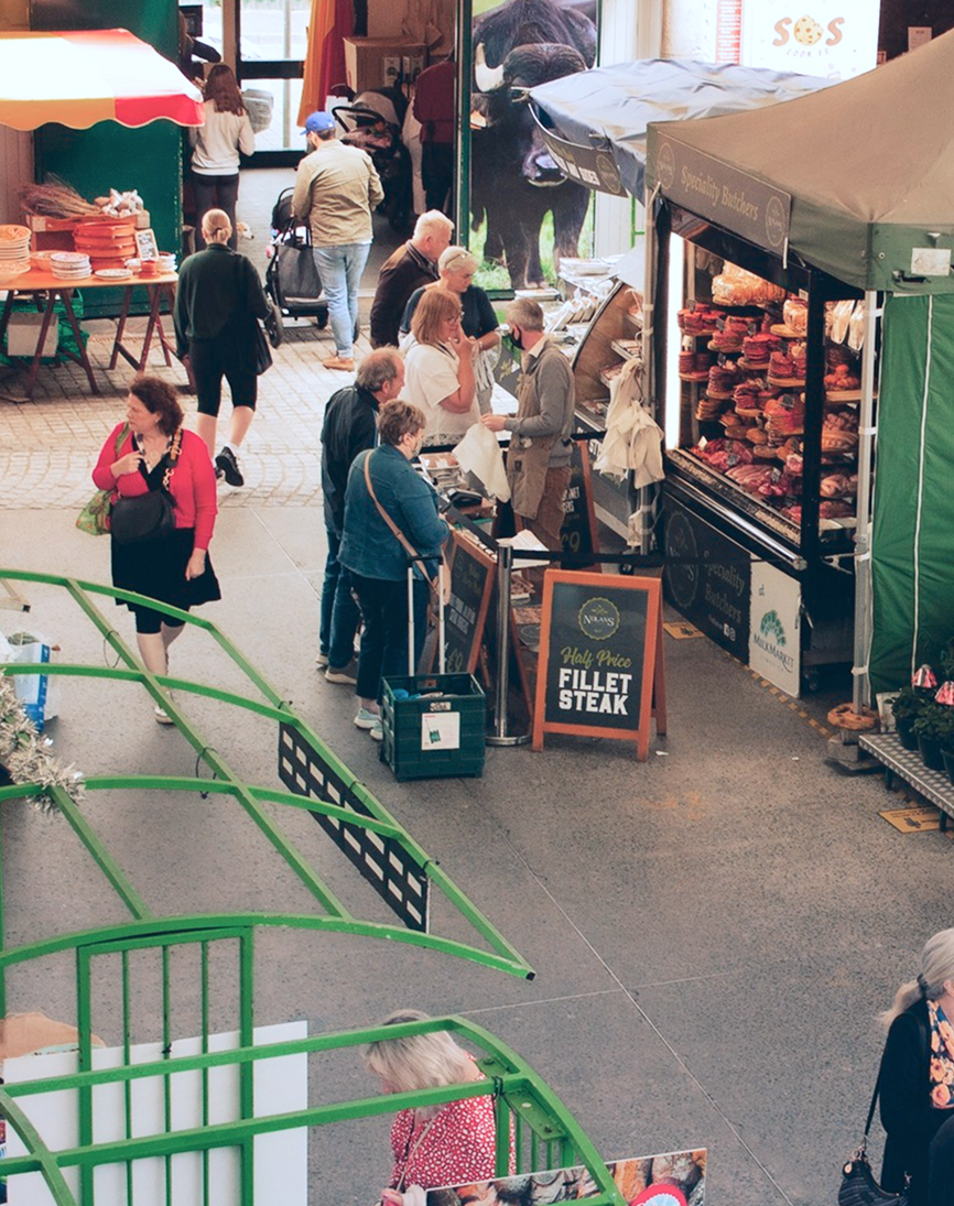 Overhead view of people shopping at the Milk Market